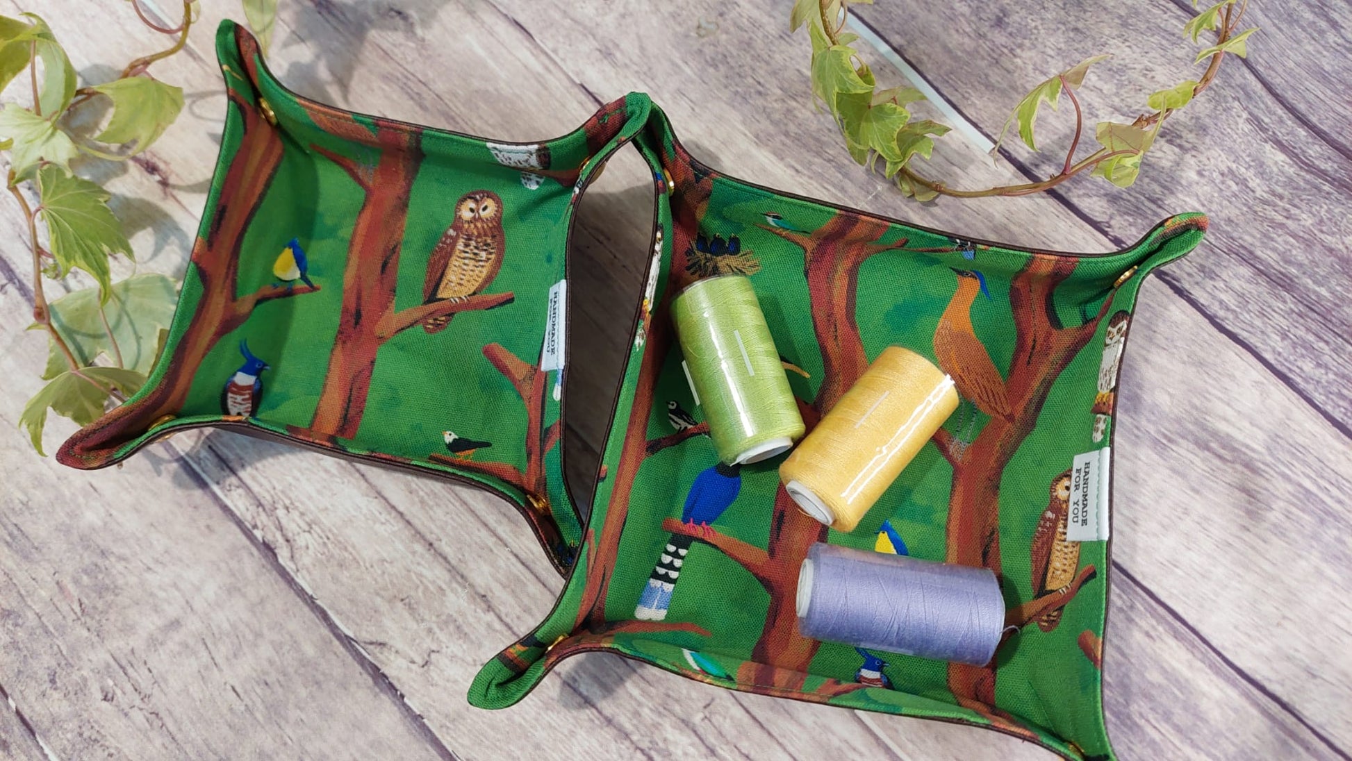 A set of 2 catchall trays, made with durable fabric and faux leather, perfect for organizing small items like keys, jewelry, or coins in style.