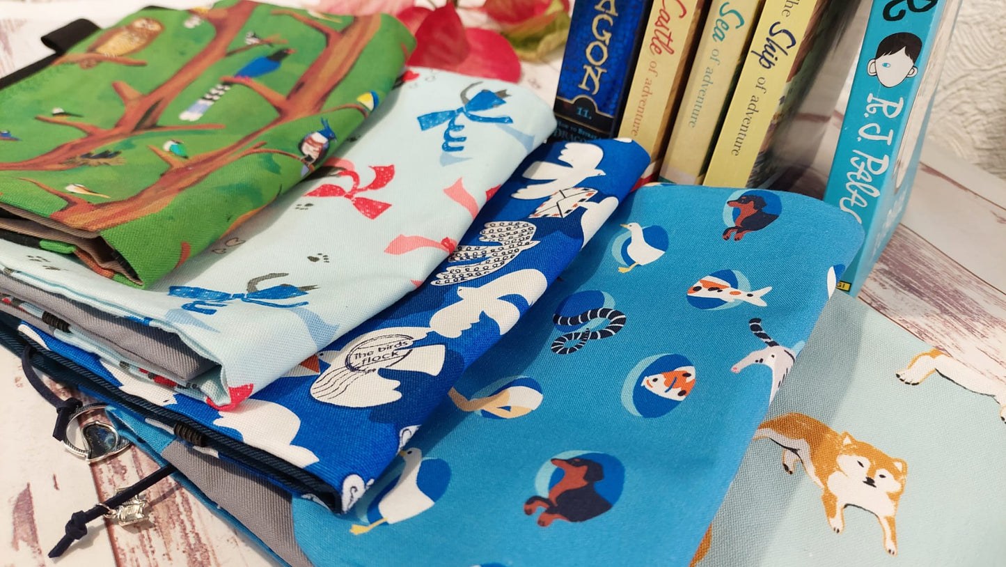 Cute handmade cloth book protector , featuring a secure pocket and pen holder, a perfect gift for book lovers and avid readers.